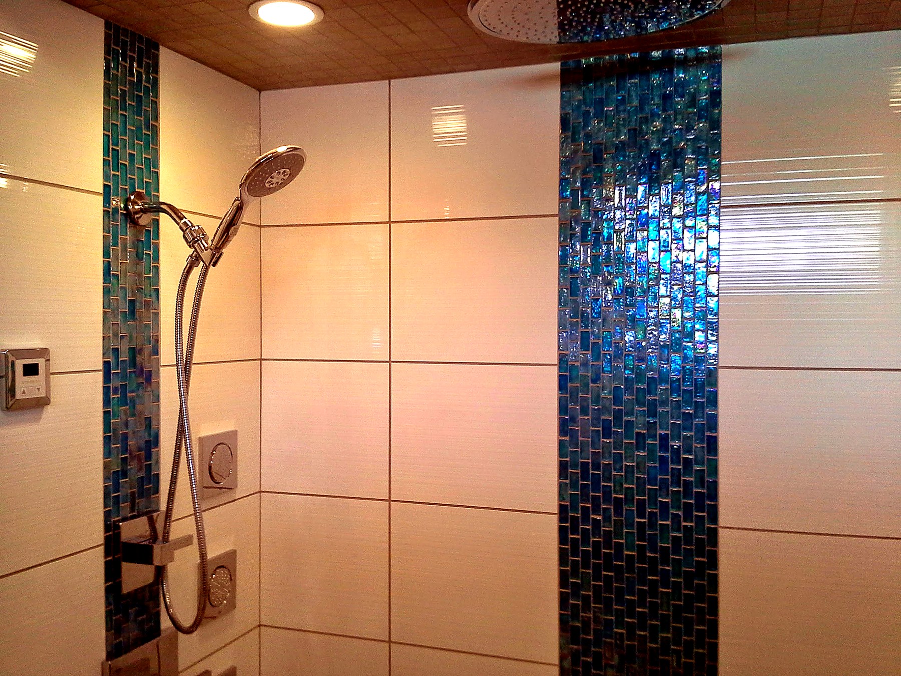 Luxury dual-head shower renovation in a Winnipeg bathroom with custom tile