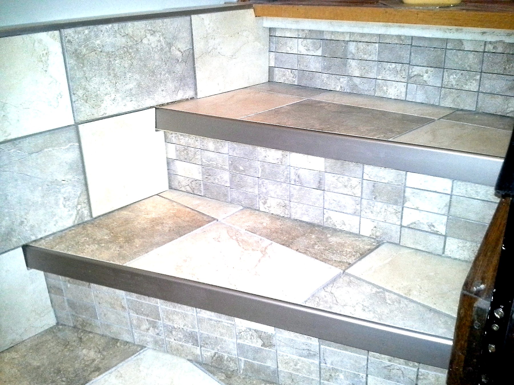Basement staircase tile renovation Winnipeg